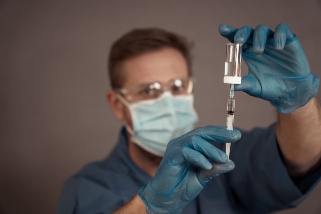 Scientist working on the development of the COVID-19 Vaccine. Coronavirus immunization treatment.