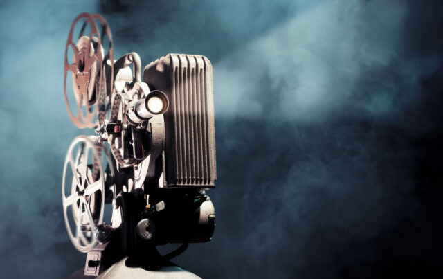 old film projector with dramatic lighting