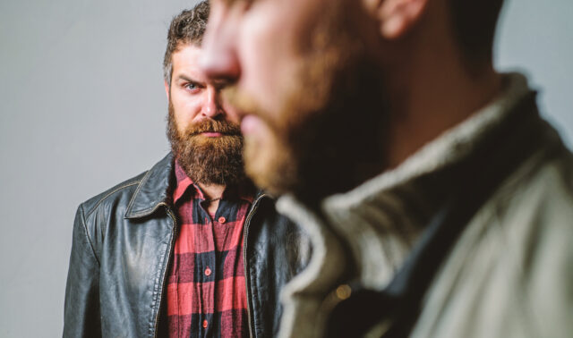 Friendship trust and support. Trustful relations. Someone behind you. Feel support of real friend. Man bearded guy stand behind back of friend hipster. True friend always near. Stand beside you