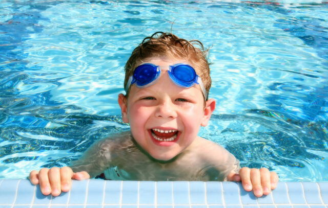 Happy child in a swimming pool