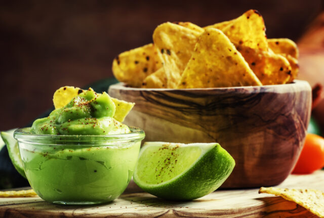 Corn nachos and avocado sauce, selective focus