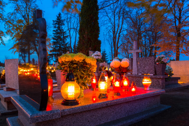 Colorful candles on the cemetery at All Saints Day, Poland